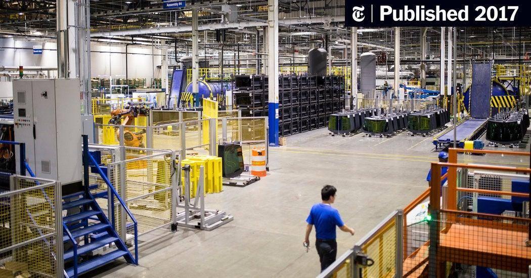 A large-scale chemical production floor in China with workers managing export logistics