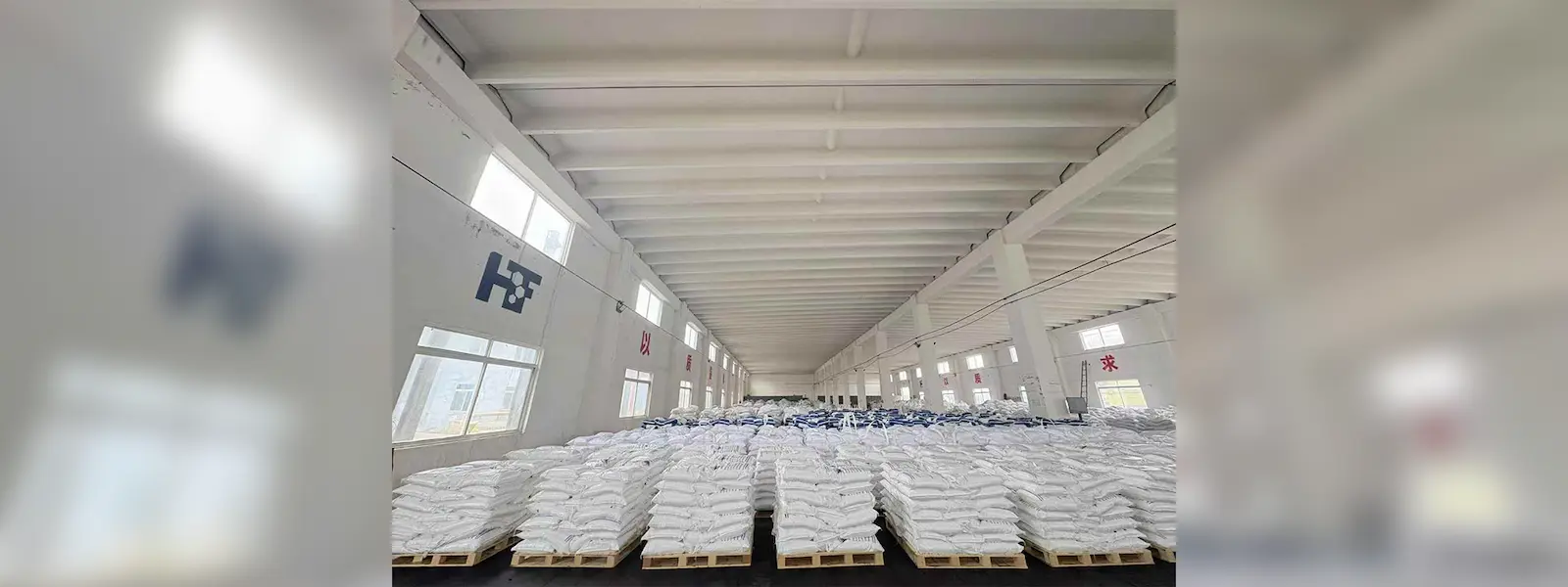 Warehouse storing bulk zinc chloride bags, ready for industrial supply