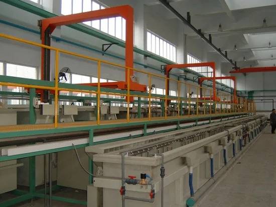 A faceless view of a modern, automated electroplating facility with multiple tanks for acid zinc plating.