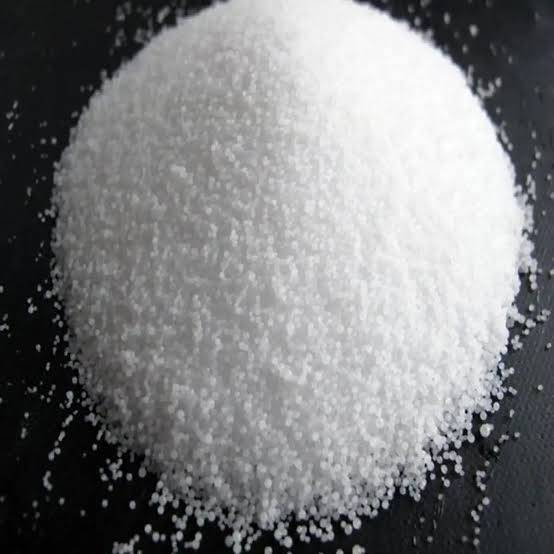 Close-up of high-purity zinc chloride, a clean white crystalline solid with no discoloration or visible impurities