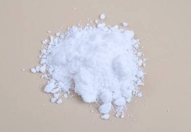 Close-up of white anhydrous zinc chloride crystalline powder, the raw material at the center of the zinc chloride vs copper chloride comparison